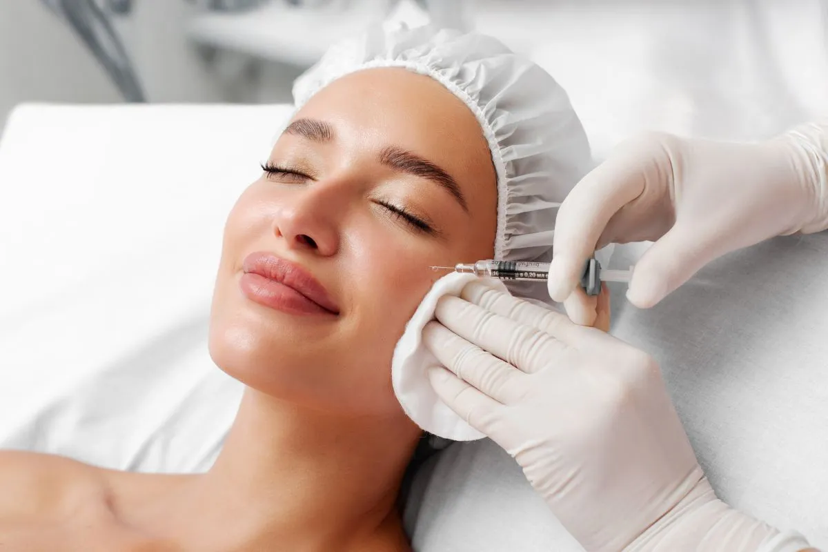 A woman receiving dermal fillers at a medical spa in Addison, TX